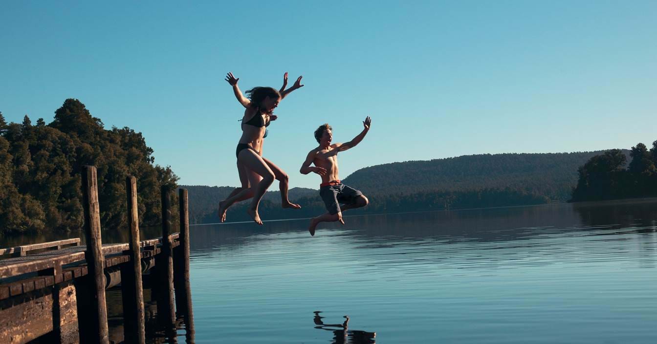 Kids jumping in lake