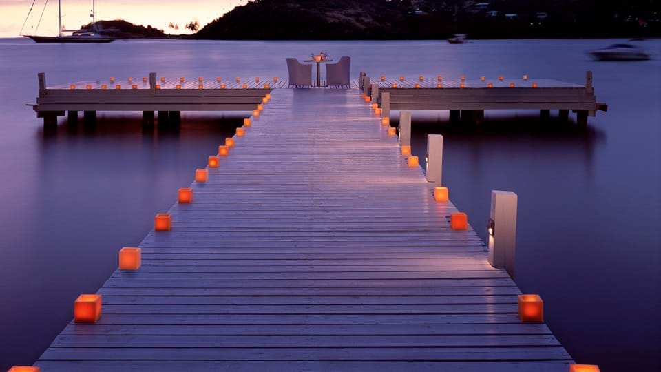 Romantic jetty dinner at Carlisle Bay overlooking tranquil water
